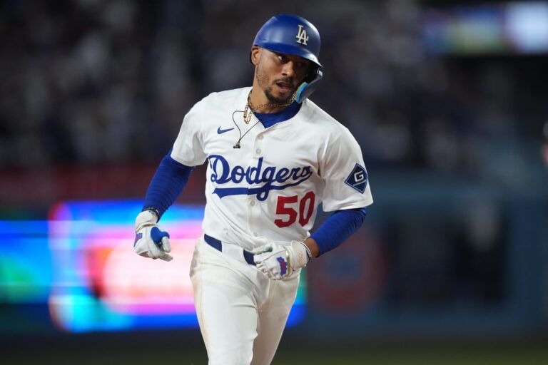 Los Angeles Dodgers shortstop Mookie Betts (50) runs the bases after hitting a home run in the fifth inning against the Toronto Blue Jays at Dodger Stadium.