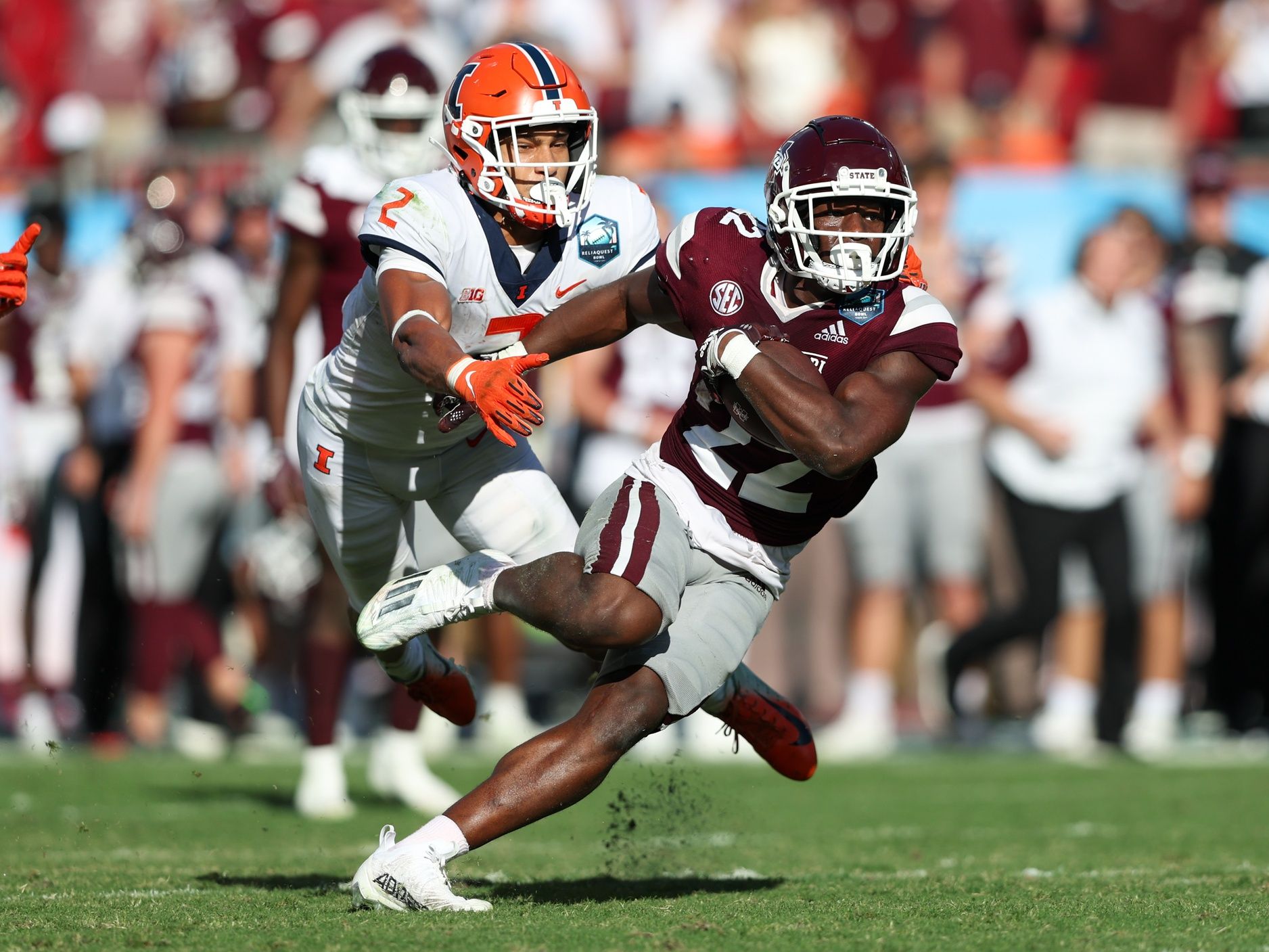 Illinois Fighting Illini defensive back Matthew Bailey (2) chases Mississippi State Bulldogs running back Simeon Price (22) during the 2023 ReliaQuest Bowl at Raymond James Stadium.
