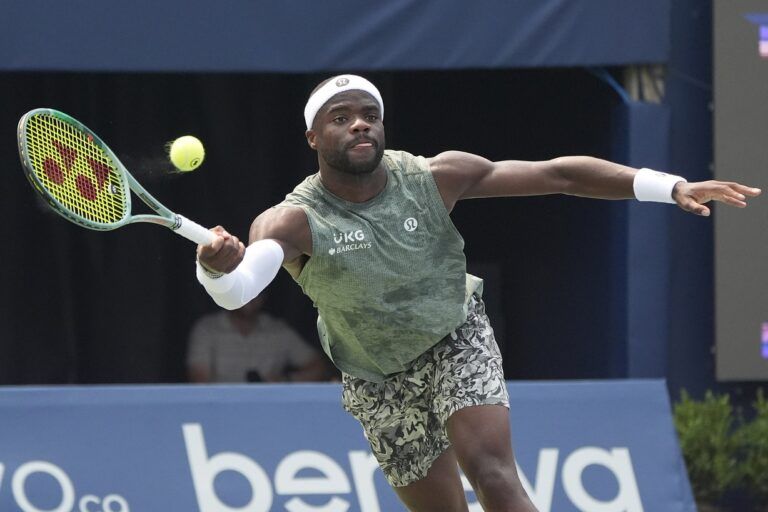 Frances Tiafoe (USA) stretches to reach a ball hit by Alex De Minaur (not pictured) during round four at Sobeys Stadium.