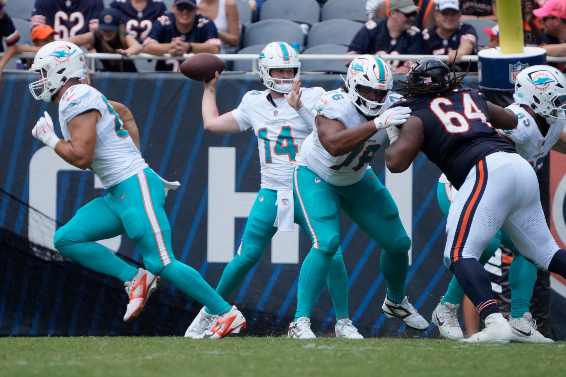 Miami Dolphins quarterback Quinn Ewers (14) passes the ball against the Chicago Bears during the second half at Soldier Field.