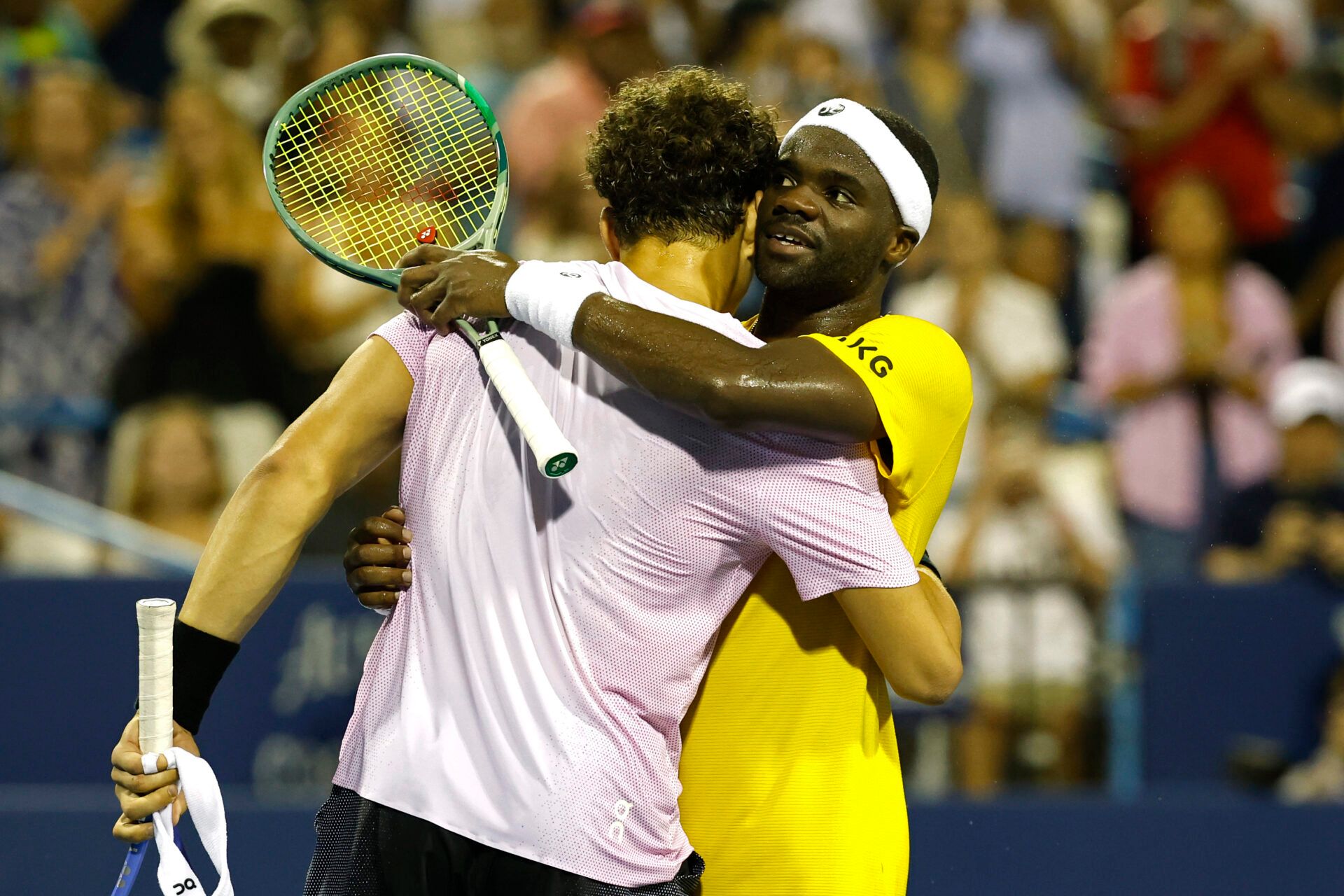 Ben Shelton (USA)(L) hugs Frances Tiafoe (USA)(R) at the net after their men's singles quarter-final of the Mubadala Citi DC Open at Rock Creek Park Tennis Center.