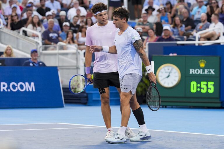 Ben Shelton (USA) stands with Camilo Ugo Carabelli (ARG) during a stop in play due to injury during the Cincinnati Open at the Lindner Family Tennis Center.