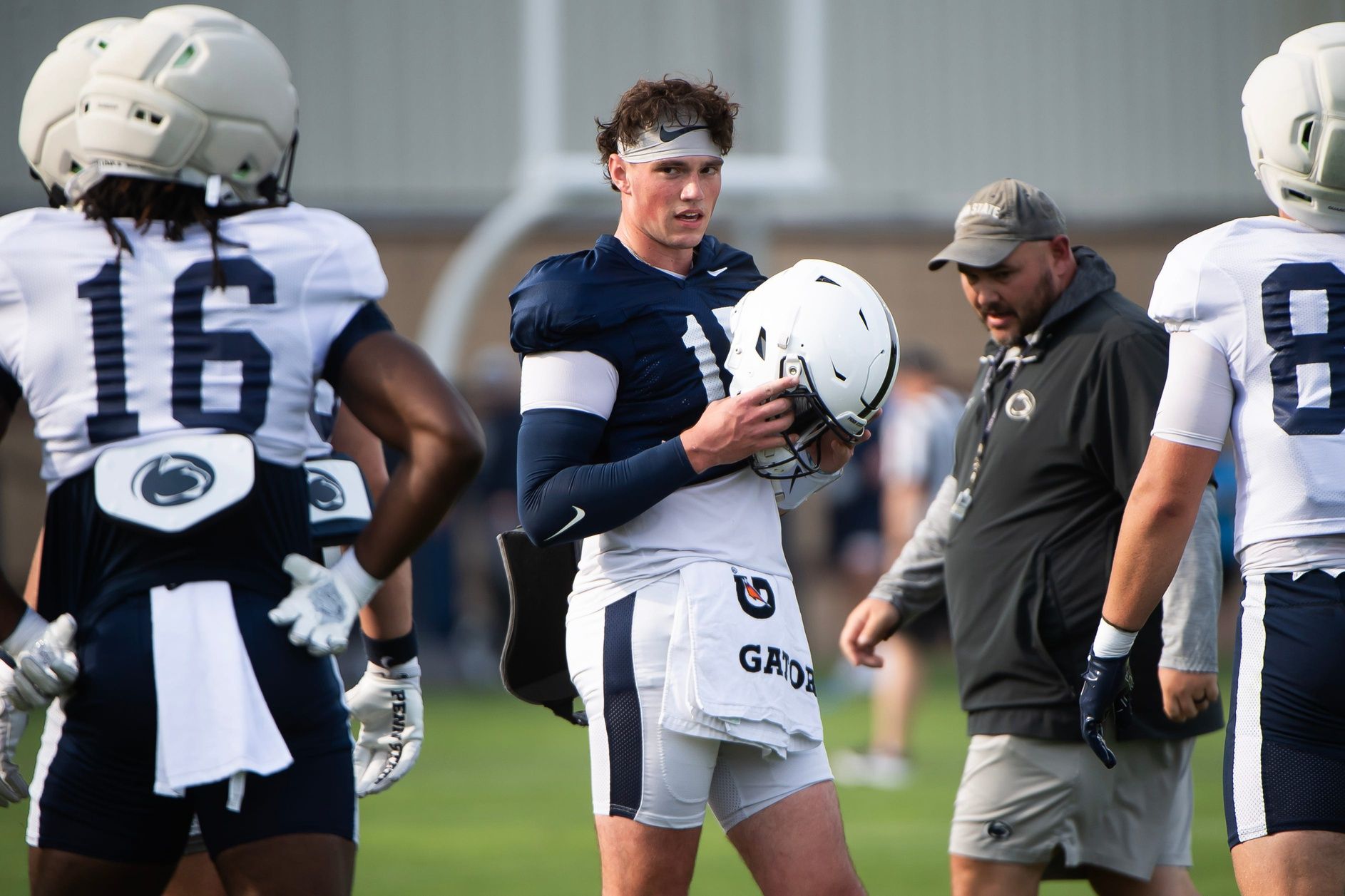 Penn State quarterback Drew Allar puts his helmet on during a practice session outside Holuba Hall on Saturday, August 2, 2025, in State College.