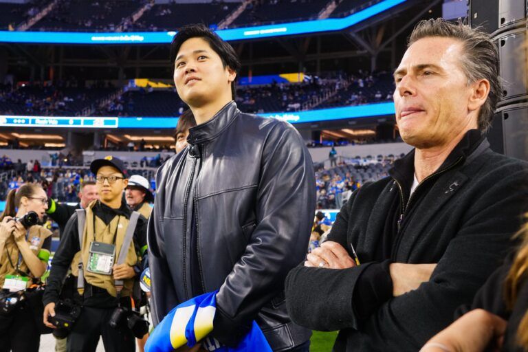 Los Angeles Dodgers player Shohei Ohtani (left) and agent Nez Balelo attend the game between the Los Angeles Rams and the New Orleans Saints at SoFi Stadium.