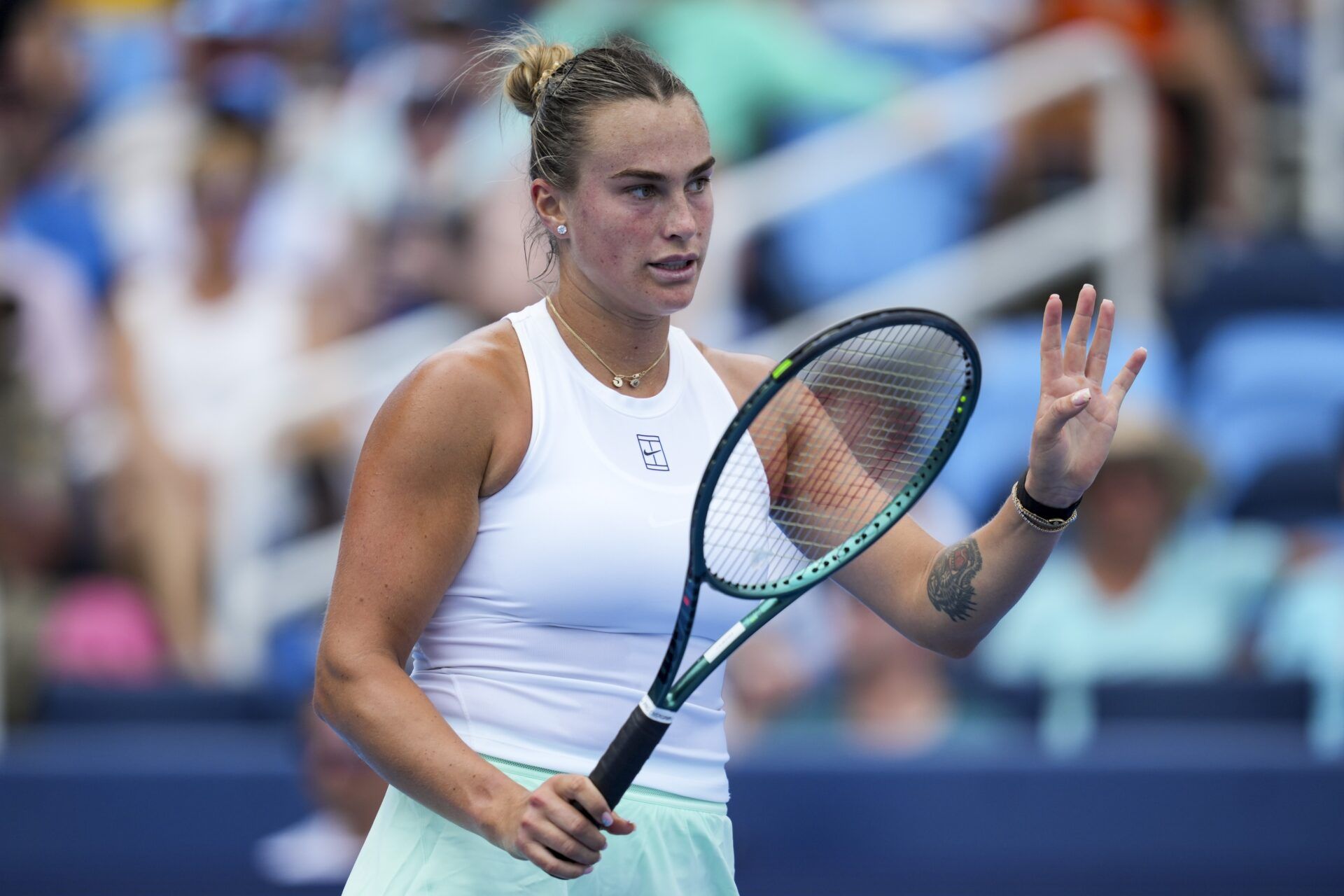 Aryna Sabalenka (BLR) reacts after returning a shot against Emma Raducanu (GBR) during the Cincinnati Open at the Lindner Family Tennis Center.