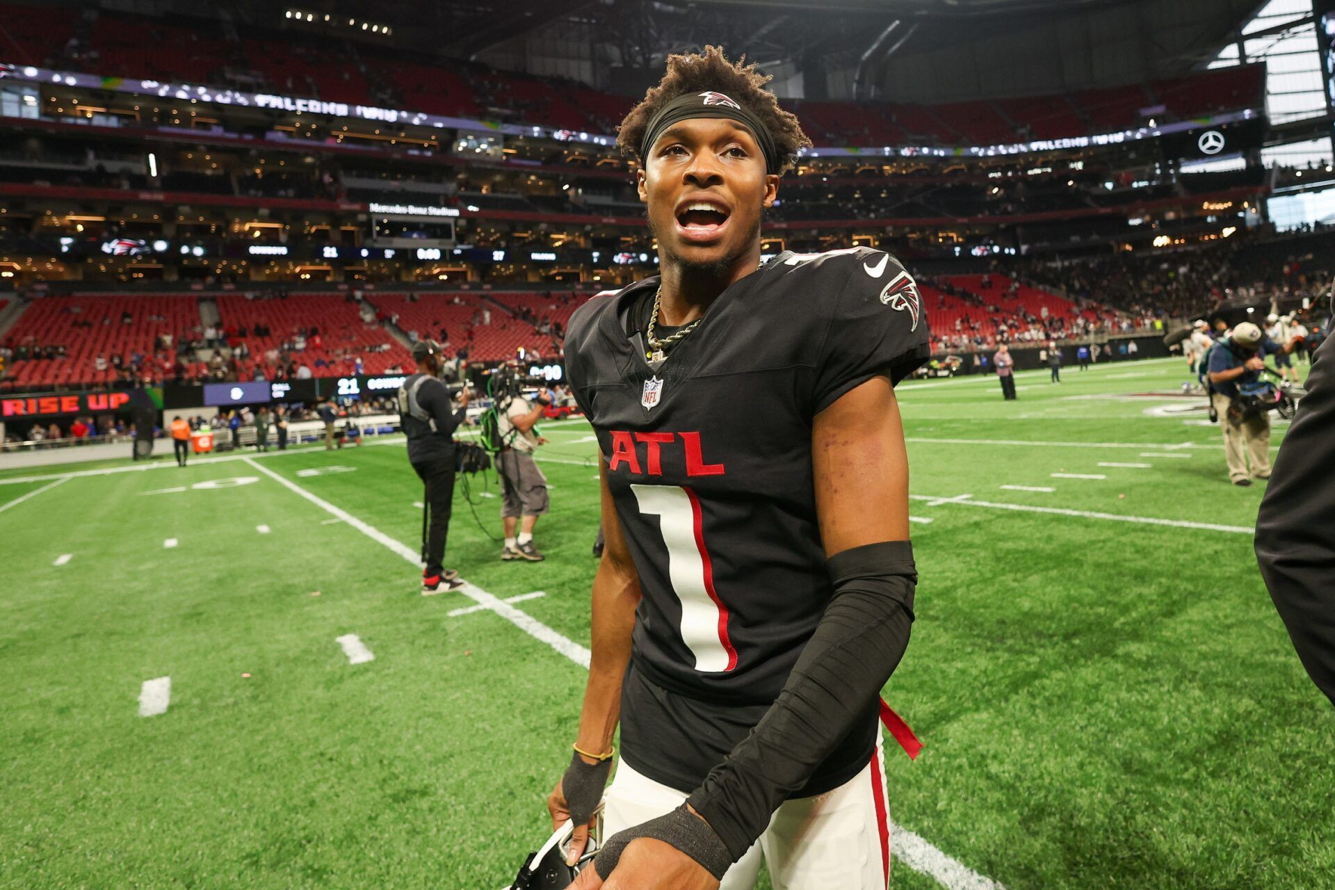 Atlanta Falcons wide receiver Darnell Mooney (1) walks off the field after a victory over the Dallas Cowboys at Mercedes-Benz Stadium.