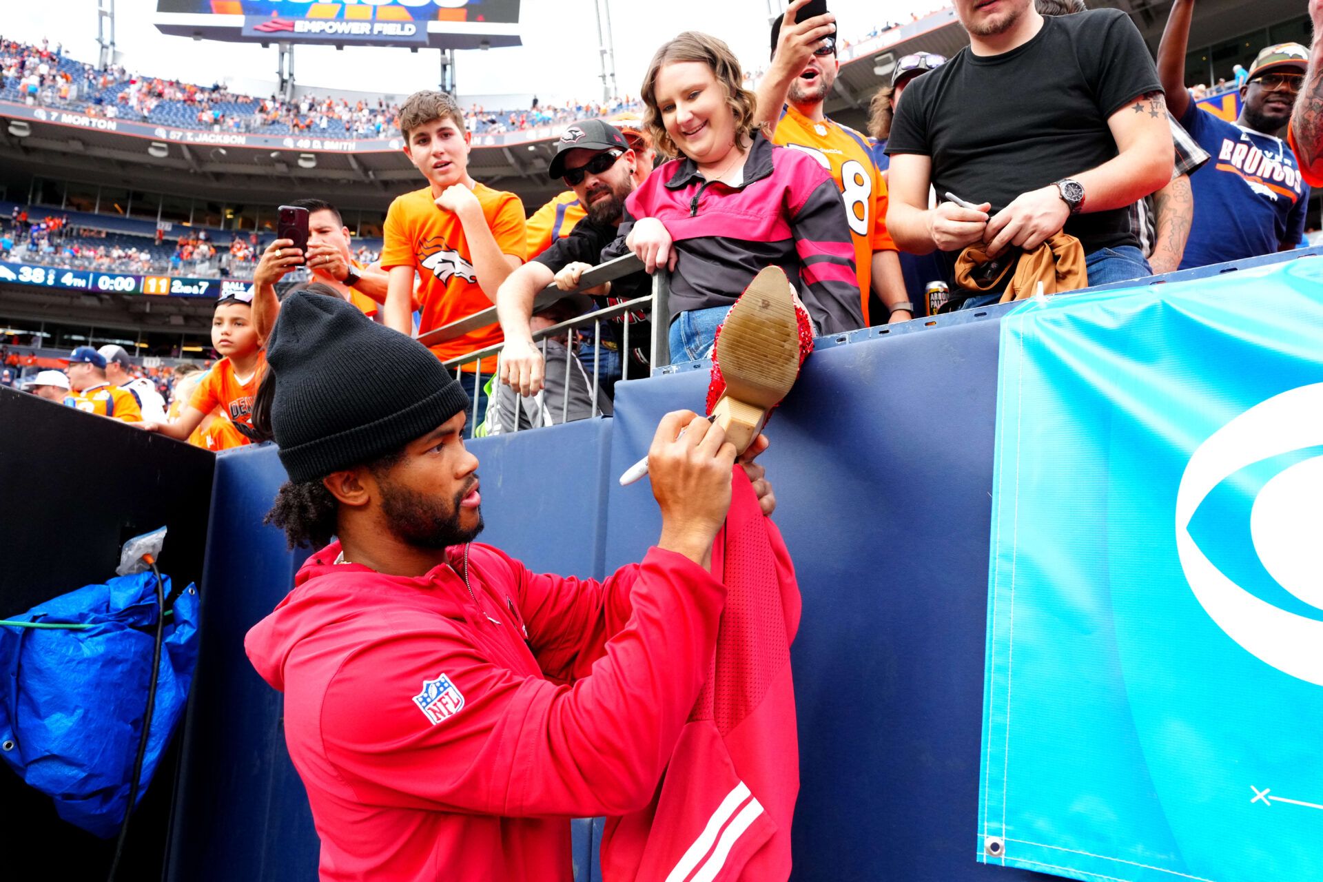 Arizona Cardinals quarterback Kyler  Murray (10) signs a fans boot following the preseason loss to the Denver Broncos at Empower Field at Mile High.