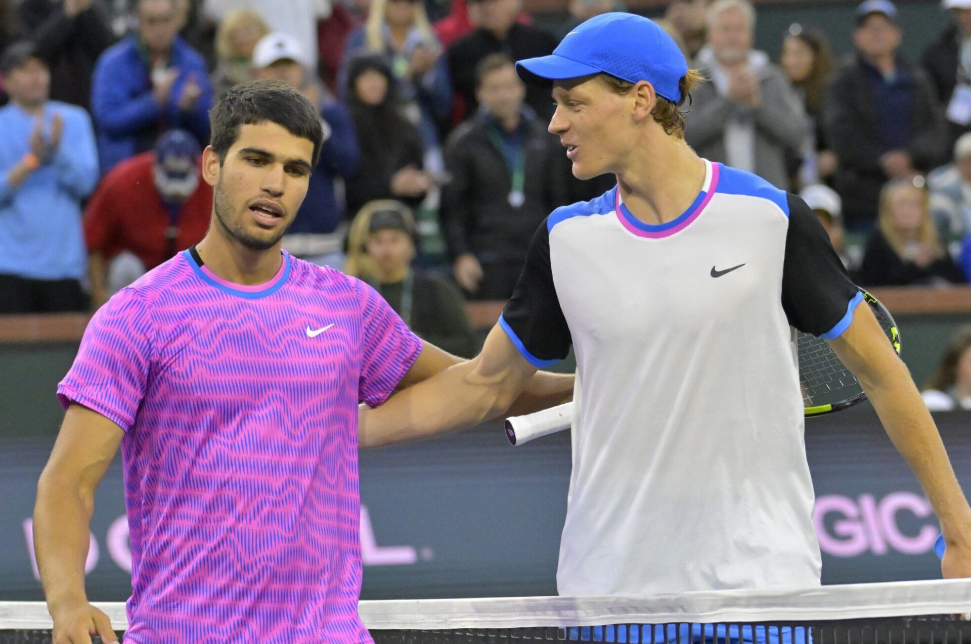 Carlos Alcaraz (ESP) is congratulated by Jannik Sinner (POL) after winning their semi-final match in the BNP Paribas Open at the Indian Wells Tennis Garden.