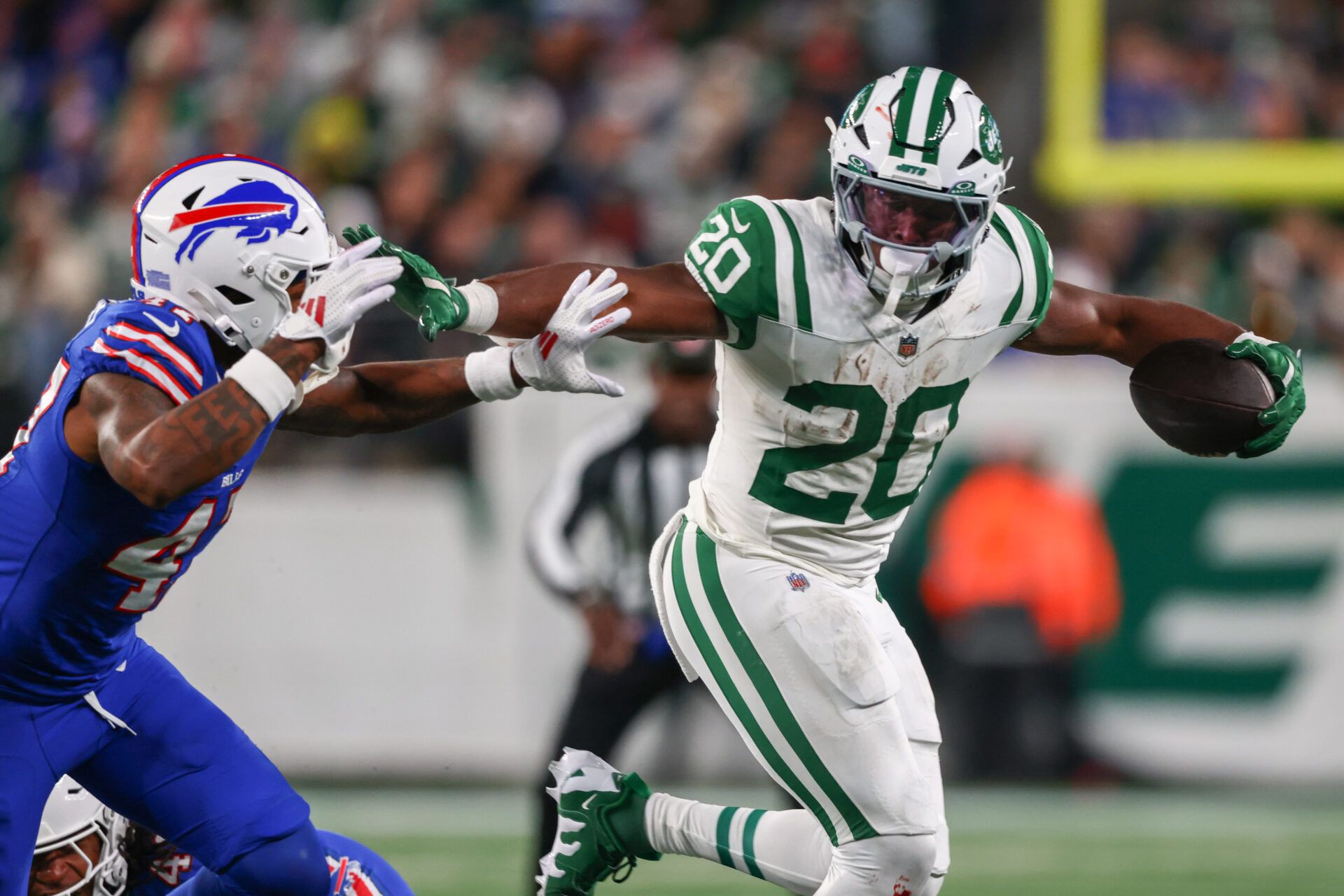 New York Jets running back Breece Hall (20) runs with the ball against the Buffalo Bills during the first half at MetLife Stadium.