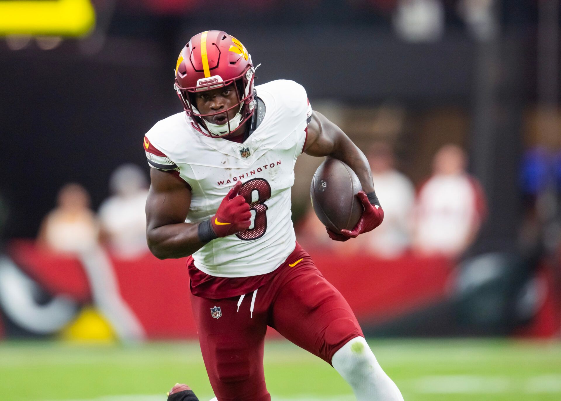 Washington Commanders running back Brian Robinson Jr. (8) against the Arizona Cardinals at State Farm Stadium.