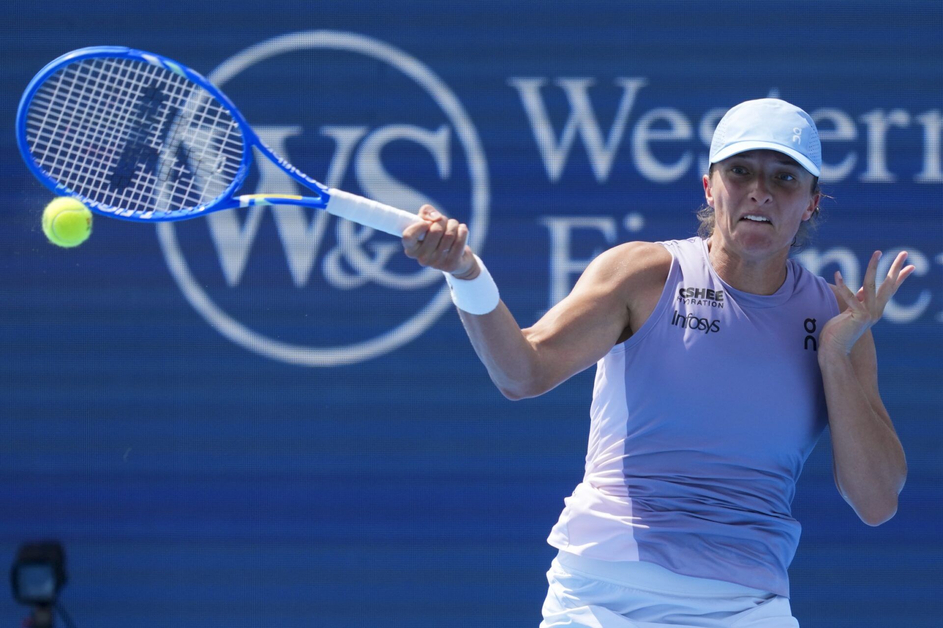 Iga Swiatek (POL) returns a shot against Sorana Cirstea (ROU) during the Cincinnati Open at the Lindner Family Tennis Center.