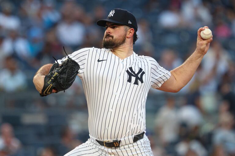 New York Yankees starting pitcher Carlos Rodon (55) delivers a pitch during the first inning against the Minnesota Twins at Yankee Stadium.