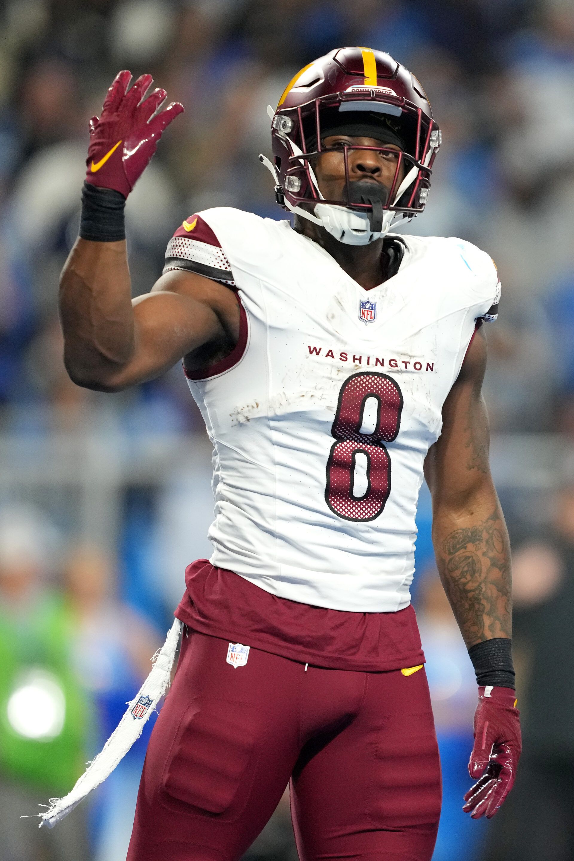 DETROIT, MICHIGAN - JANUARY 18: Brian Robinson Jr. #8 of the Washington Commanders celebrates after running the ball for a touchdown during the second quarter against the Detroit Lions in the NFC Divisional Playoff at Ford Field on January 18, 2025 in Detroit, Michigan.  (Photo by Nic Antaya/Getty Images)