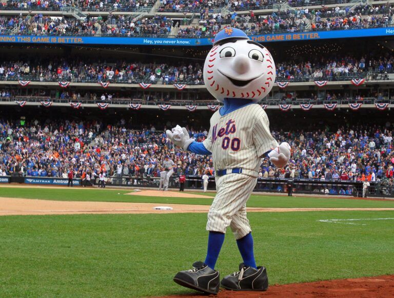 Mr. Met tosses t-shirts into the stands during the seventh inning stretch of a MLB opening day game between the New York Mets and the San Diego Padres at Citi Field.