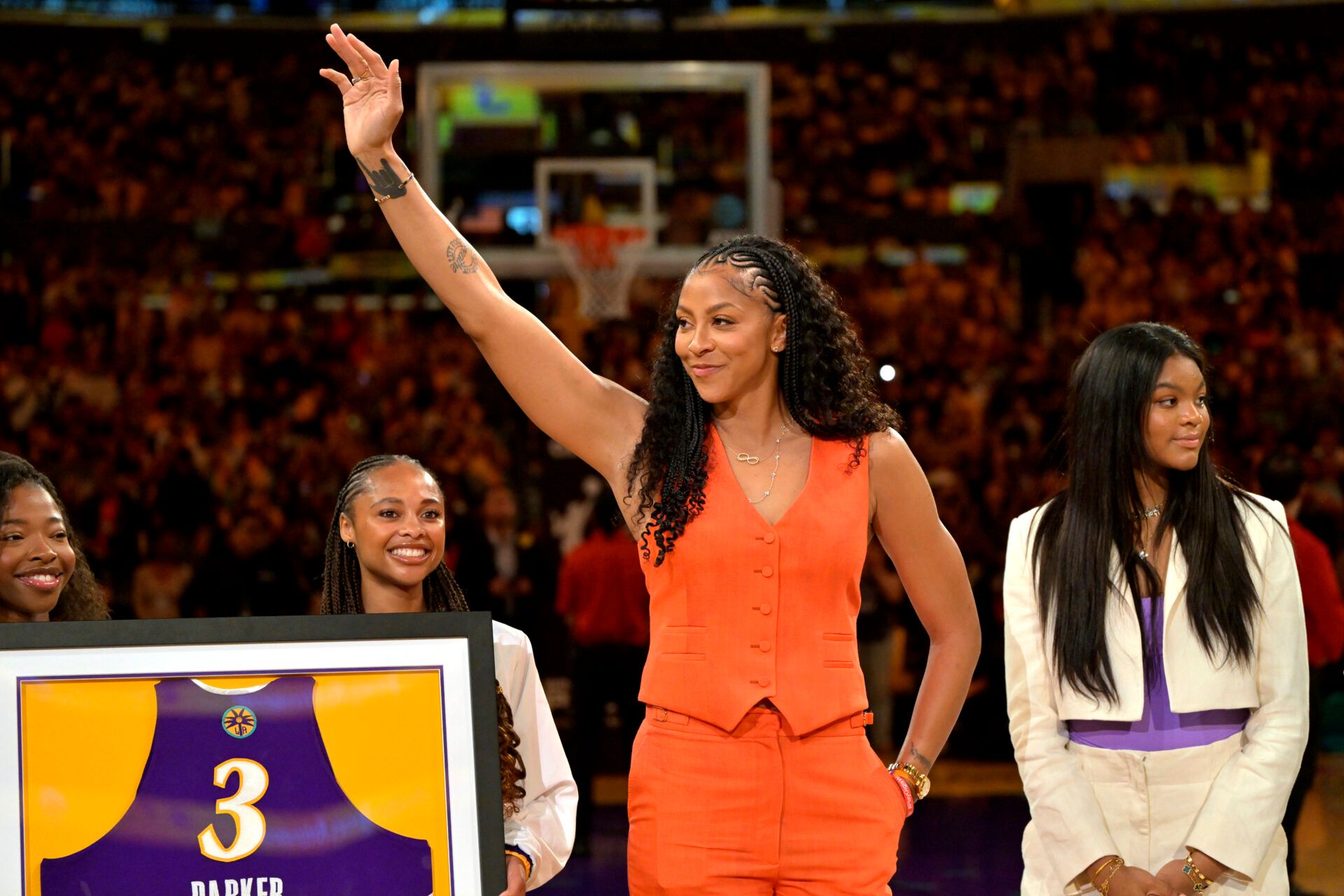 Former Los Angeles Sparks Candace Parker acknowledges the crowd during a  jersey retirement ceremony at halftime at Crypto.com Arena.