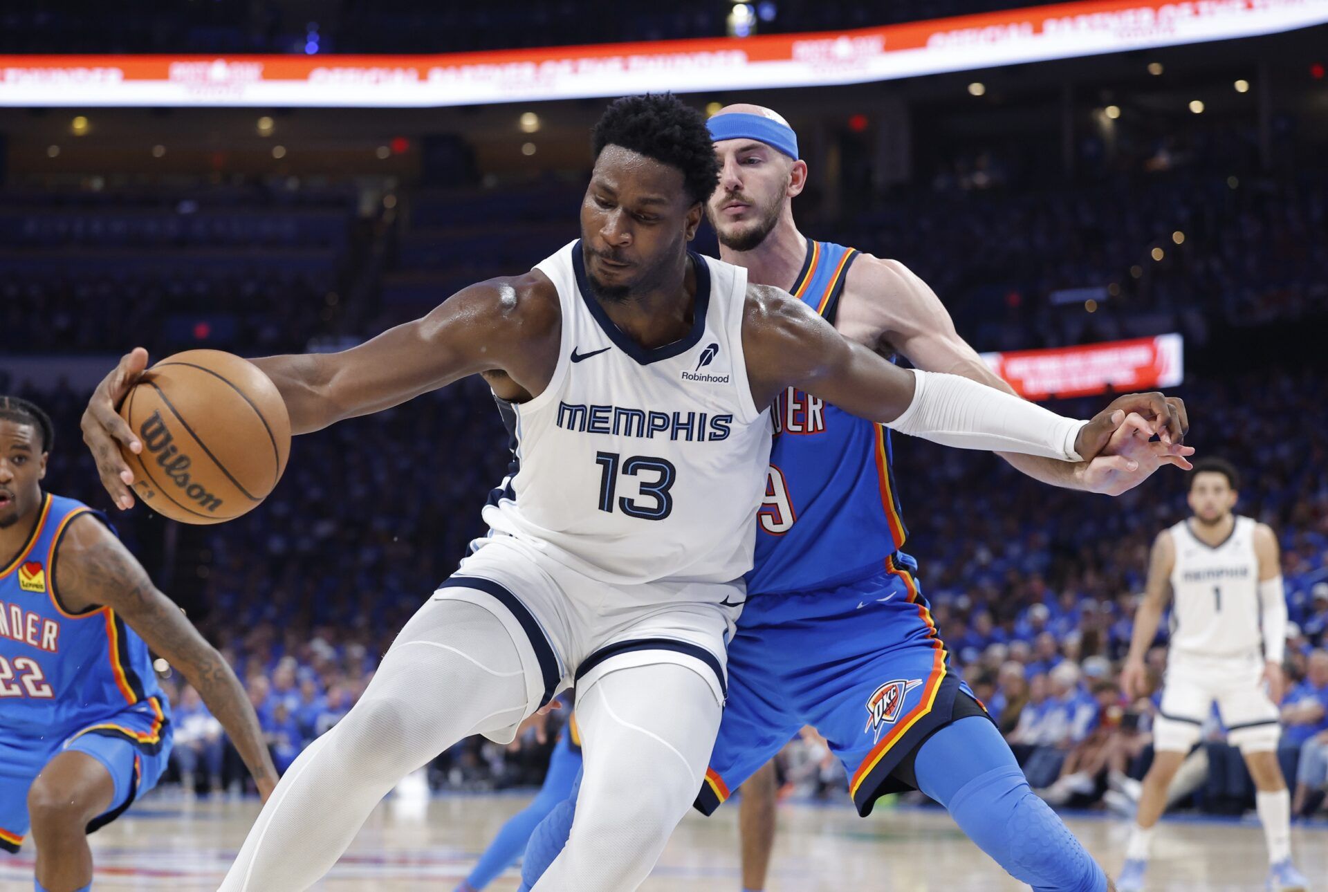 Memphis Grizzlies forward Jaren Jackson Jr. (13) moves the ball against Oklahoma City Thunder guard Alex Caruso (9) in the third quarter during game two of first round for the 2024 NBA Playoffs at Paycom Center.