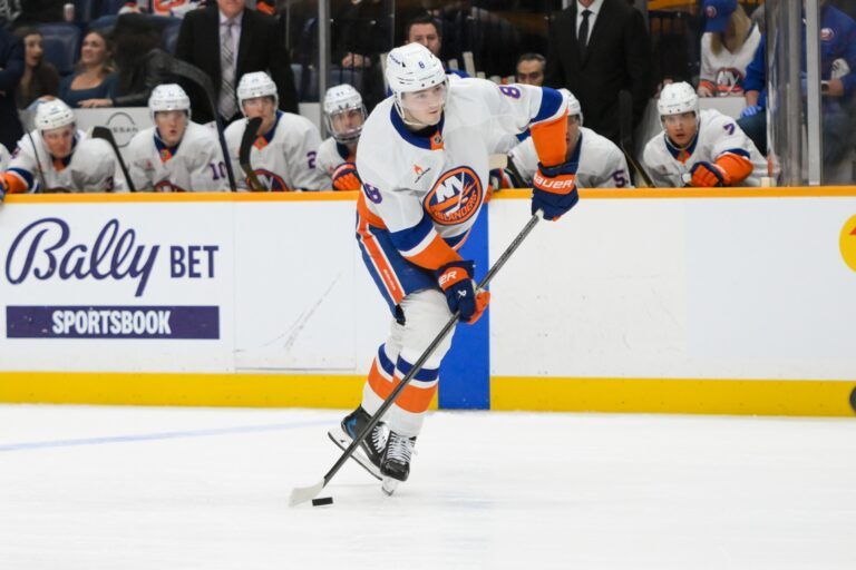 New York Islanders defenseman Noah Dobson (8) takes a shot on goal against the Nashville Predators  during the second period at Bridgestone Arena.