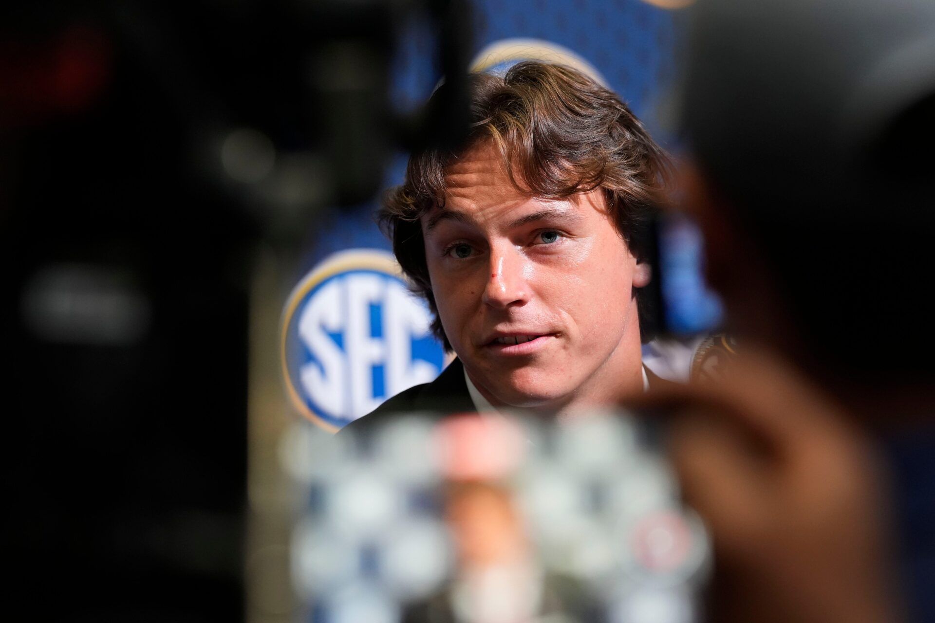 Oklahoma quarterback John Mateer speaks to reporters during SEC Media Days at the College Football Hall of Fame in Atlanta. IMAGN