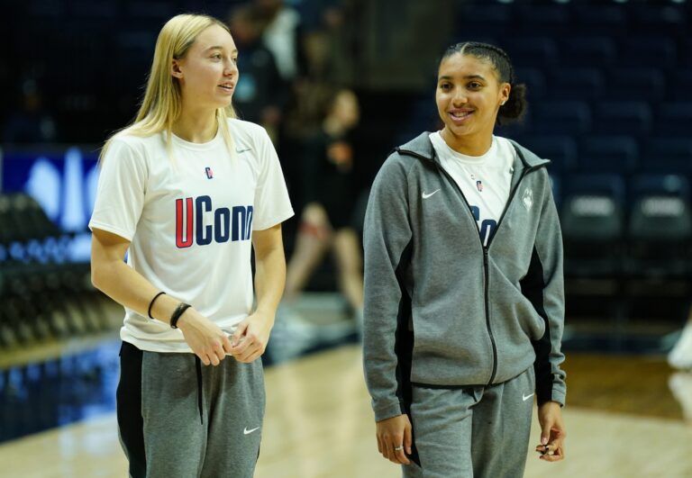 UConn Huskies guard Paige Bueckers (5) and guard Azzi Fudd (35) on the court as their teammates warm up before the start of the game against the Princeton Tigers at Harry A. Gampel Pavilion.