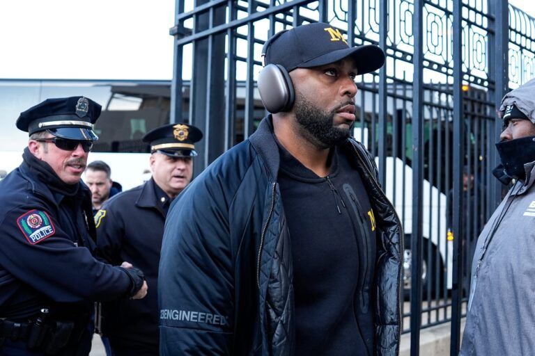 Michigan head coach Sherrone Moore walks off the bus as team arrive for the game between Ohio State and Michigan at Ohio Stadium in Columbus, Ohio on Saturday, Nov. 30, 2024.