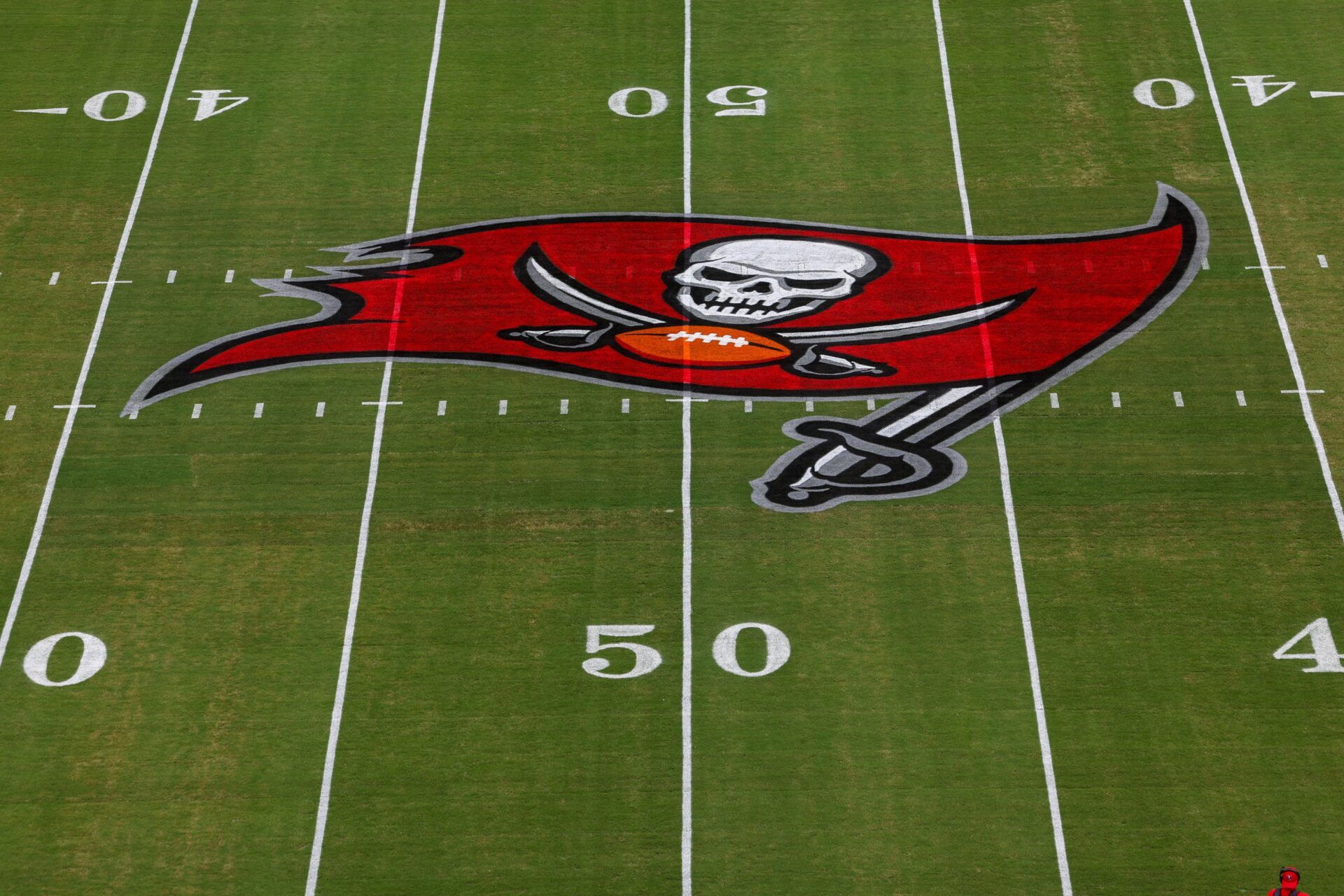 a view of the Tampa Bay Buccaneers logo at midfield before a game against the Washington Commanders at Raymond James Stadium.