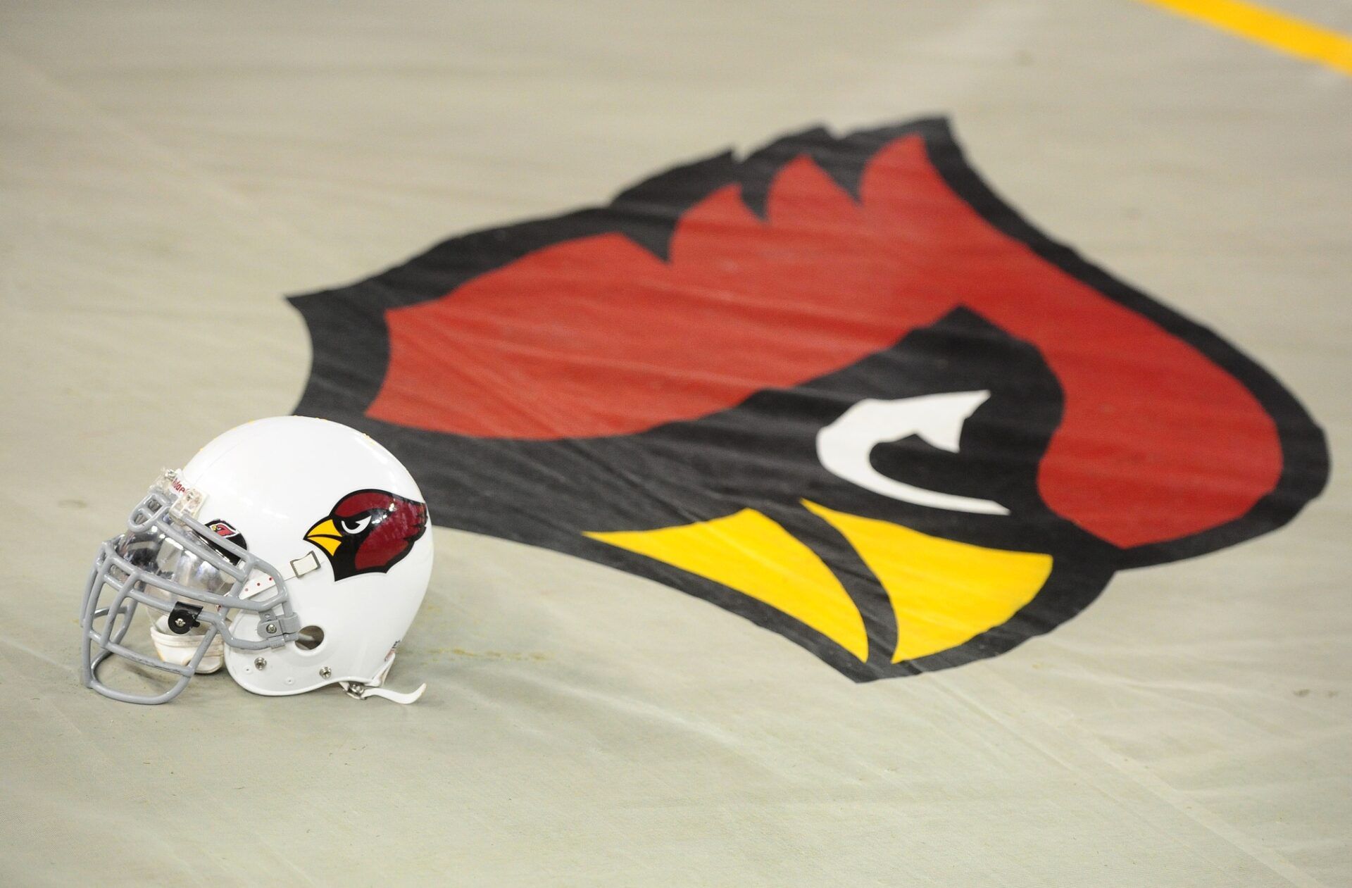 Aug. 27, 2011; Glendale, AZ, USA; Detailed view of an Arizona Cardinals helmet and team logo against the San Diego Chargers during a preseason game at University of Phoenix Stadium.