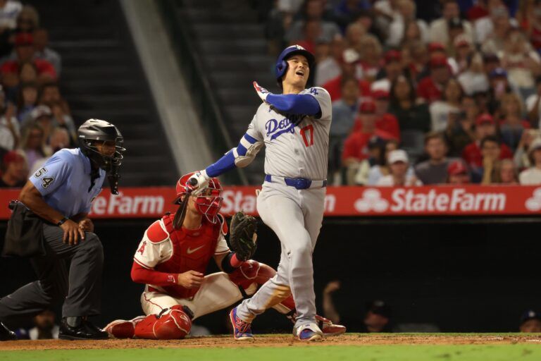 Los Angeles Dodgers two-way player Shohei Ohtani (17) strikes out during the eighth inning against the Los Angeles Angels at Angel Stadium.