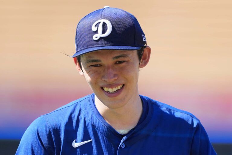 Los Angeles Dodgers pitcher Roki Sasaki (11) reacts before the game against the Toronto Blue Jays at Dodger Stadium.