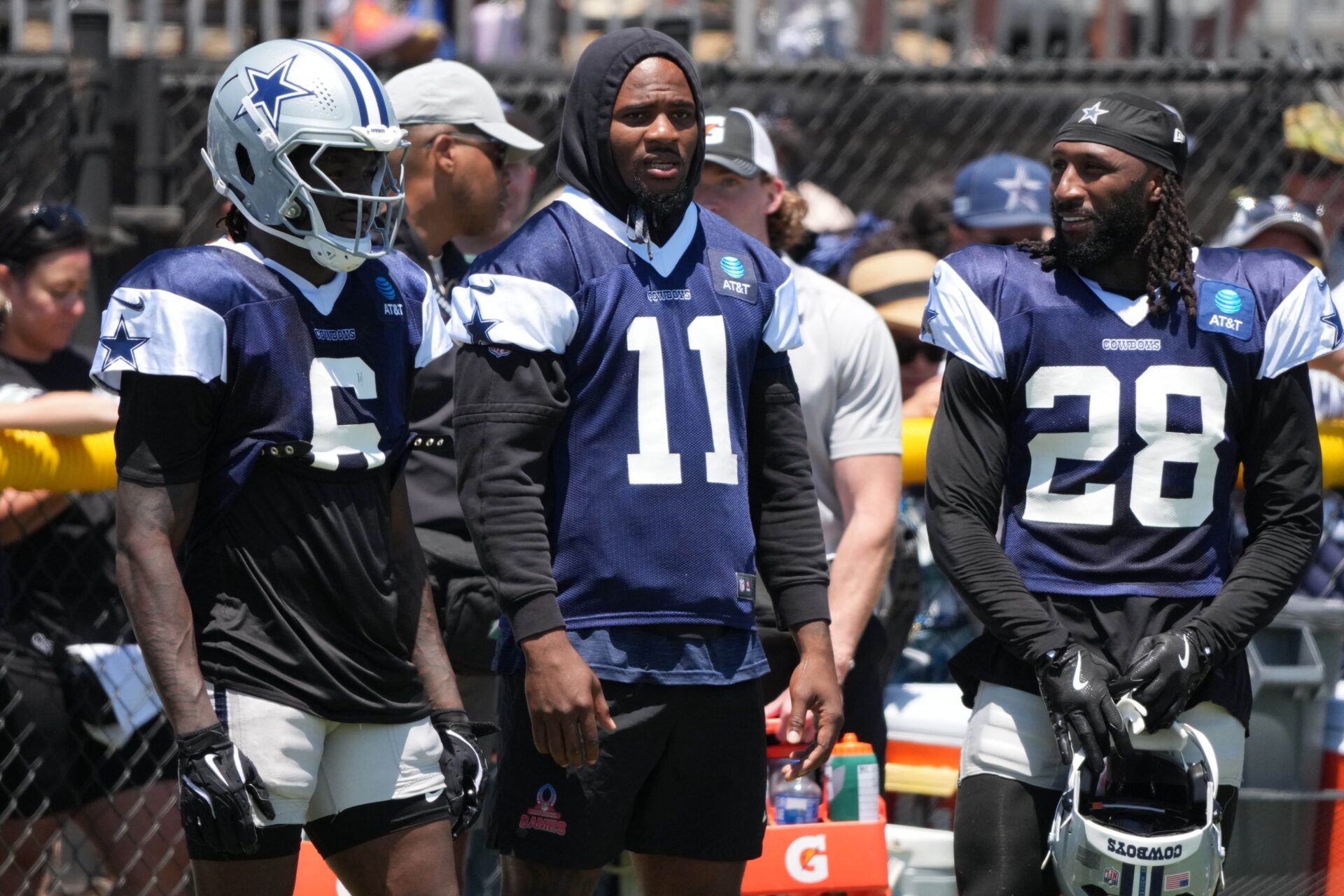 Dallas Cowboys safety Donovan Wilson (6), defensive end Micah Parsons (11) and safety Malik Hooker (28) watch from  the sidelines at training camp at the River Ridge Fields.