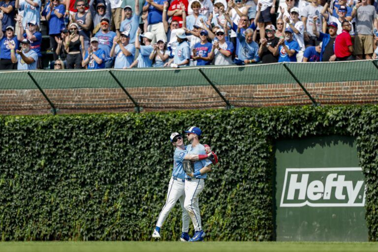 Chicago Cubs right fielder Kyle Tucker (30) celebrates with center fielder Pete Crow-Armstrong (4) after catching final fly out of the game against the Boston Red Sox during the ninth inning at Wrigley Field.