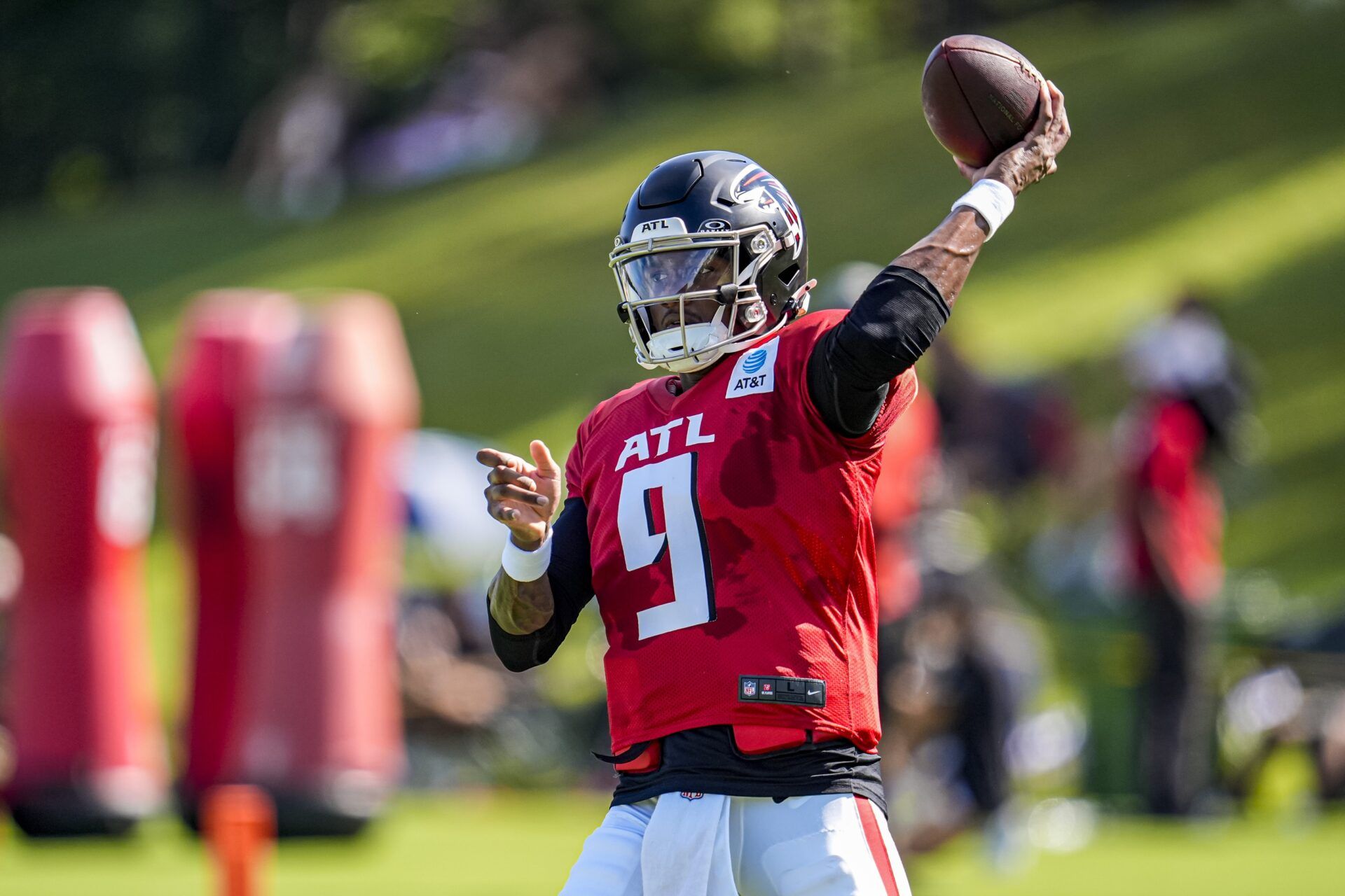 Atlanta Falcons quarterback Michael Penix Jr. (9) passes the ball during practice at training camp at IBM Performance Field.