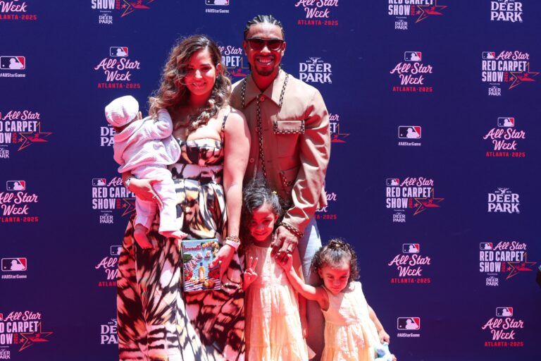 National League shortstop Francisco Lindor (12) of the New York Mets poses for a photo with family on the red carpet before the 2025 MLB All Star Game at Truist Park.