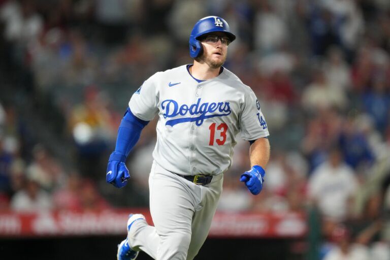 Los Angeles Dodgers third baseman Max Muncy (13) runs the bases after hitting a three-run home run in the eighth inning against the Los Angeles Angels at Angel Stadium.