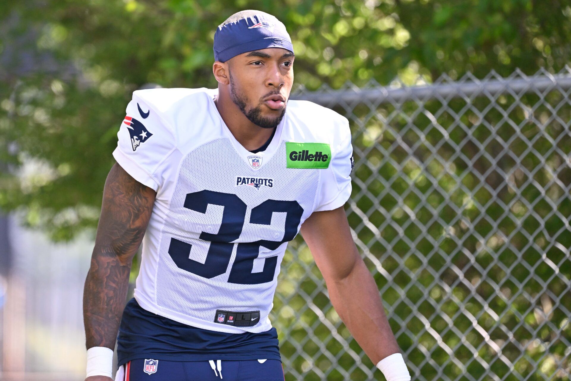 New England Patriots running back TreVeyon Henderson (32) heads to the practice fields for training camp at Gillette Stadium.