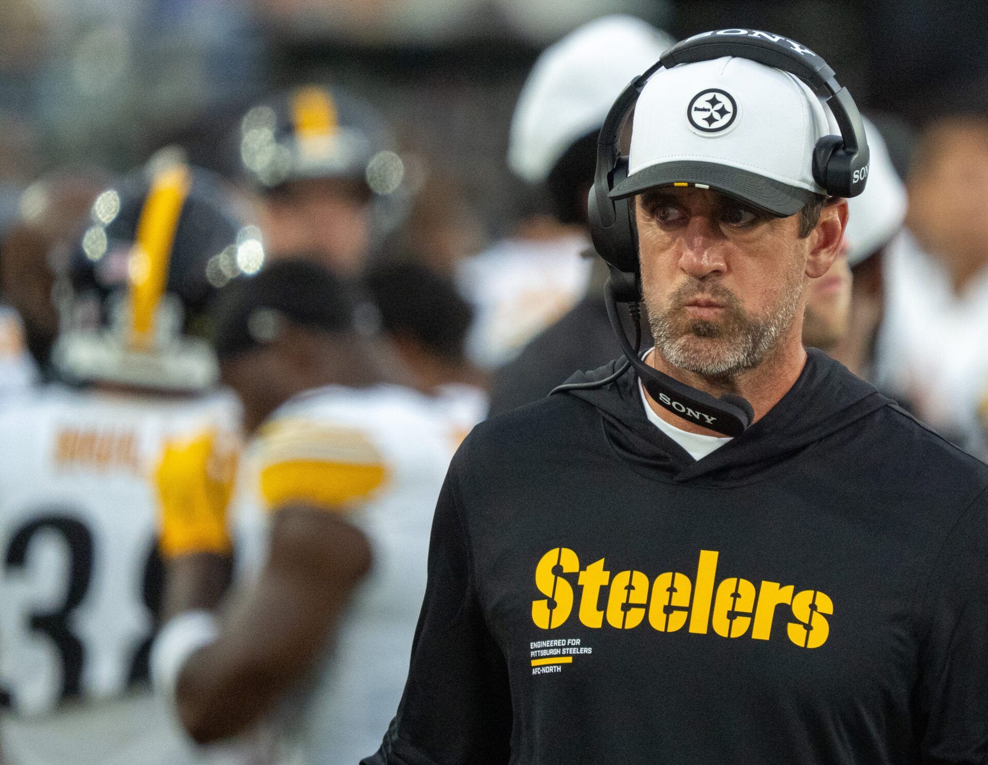 Pittsburgh Steelers quarterback Aaron Rodgers (8) walks along the sideline with a head set during the first half of the first preseason game where the Jacksonville Jaguars hosted the Pittsburgh Steelers Saturday Aug. 9, 2025, at EverBank Stadium in Jacksonville, Fla. [Doug Engle/Florida Times-Union]