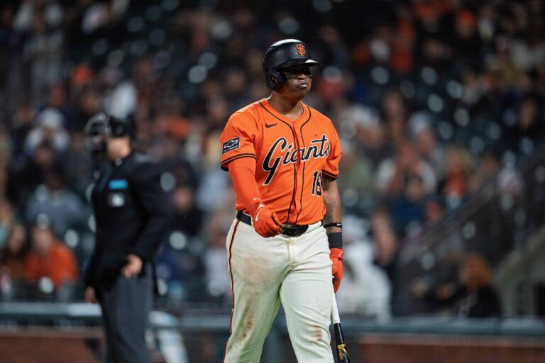 San Francisco Giants first baseman Rafael Devers (16) reacts after a called third strike against the Tampa Bay Rays during the seventh inning at Oracle Park.