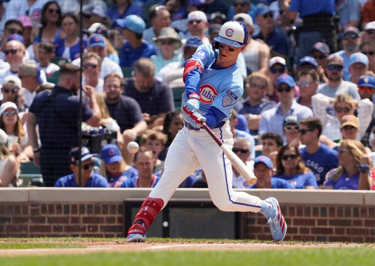 Chicago Cubs outfielder Pete Crow-Armstrong (4) hits a double against the Pittsburgh Pirates during the second inning at Wrigley Field.