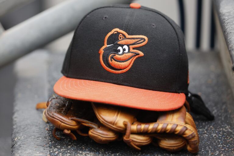 Baltimore Orioles cap and glove sits in dugout in the second inning against the Detroit Tigers at Comerica Park.