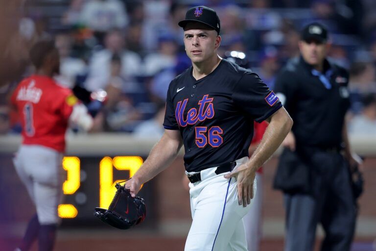 New York Mets relief pitcher Ryan Helsley (56) reacts as he walks off the field after the top of the eighth inning against the Atlanta Braves at Citi Field.