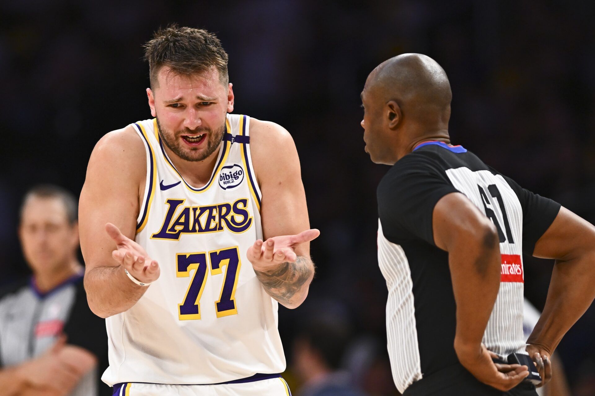 Los Angeles Lakers guard Luka Doncic (77) reacts to a call from referee Courtney Kirkland (61) against the Chicago Bulls during the second half at Crypto.com Arena.