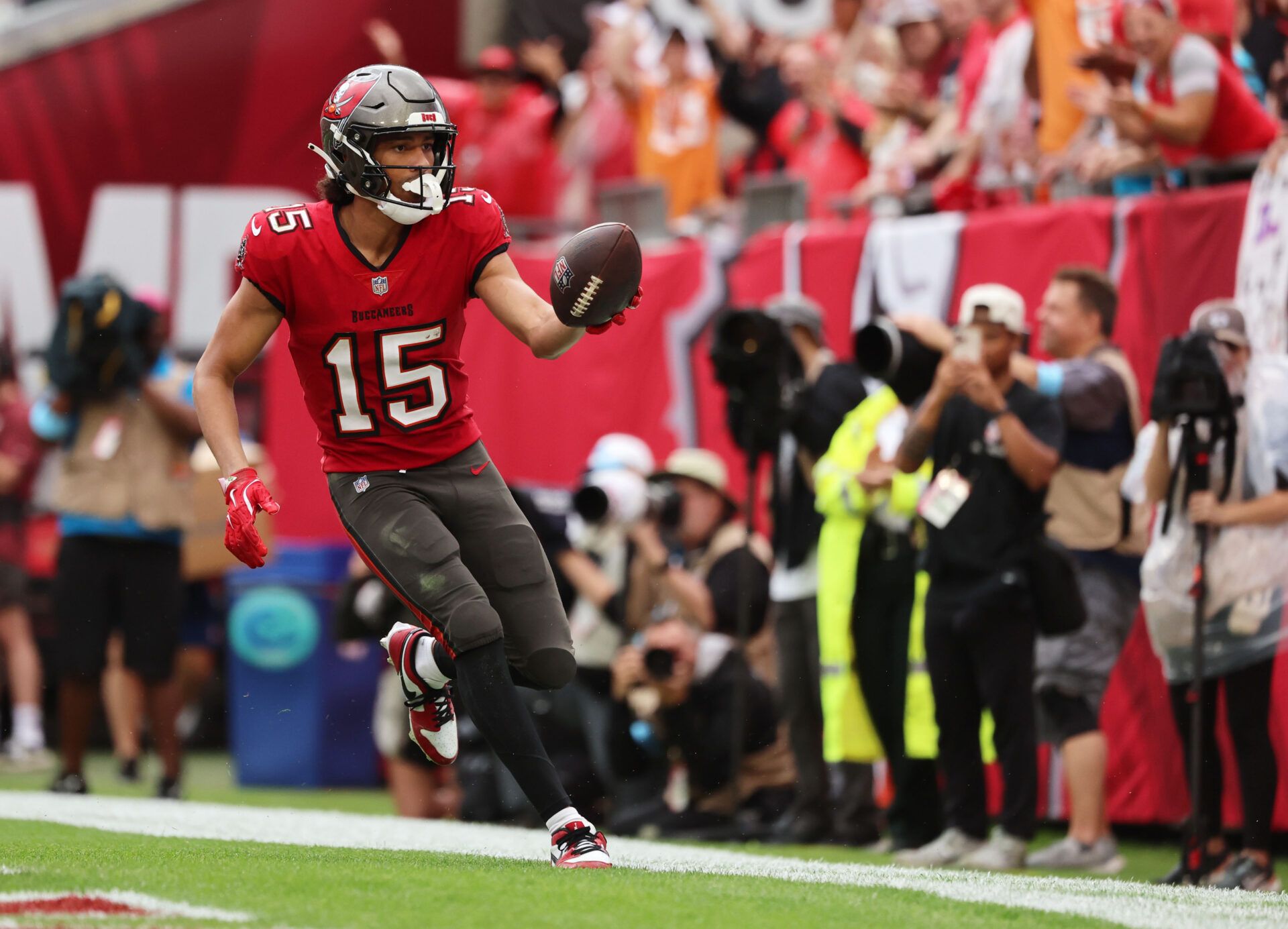 Tampa Bay Buccaneers wide receiver Jalen McMillan (15) scores a touchdown against the Carolina Panthers during the second half at Raymond James Stadium.