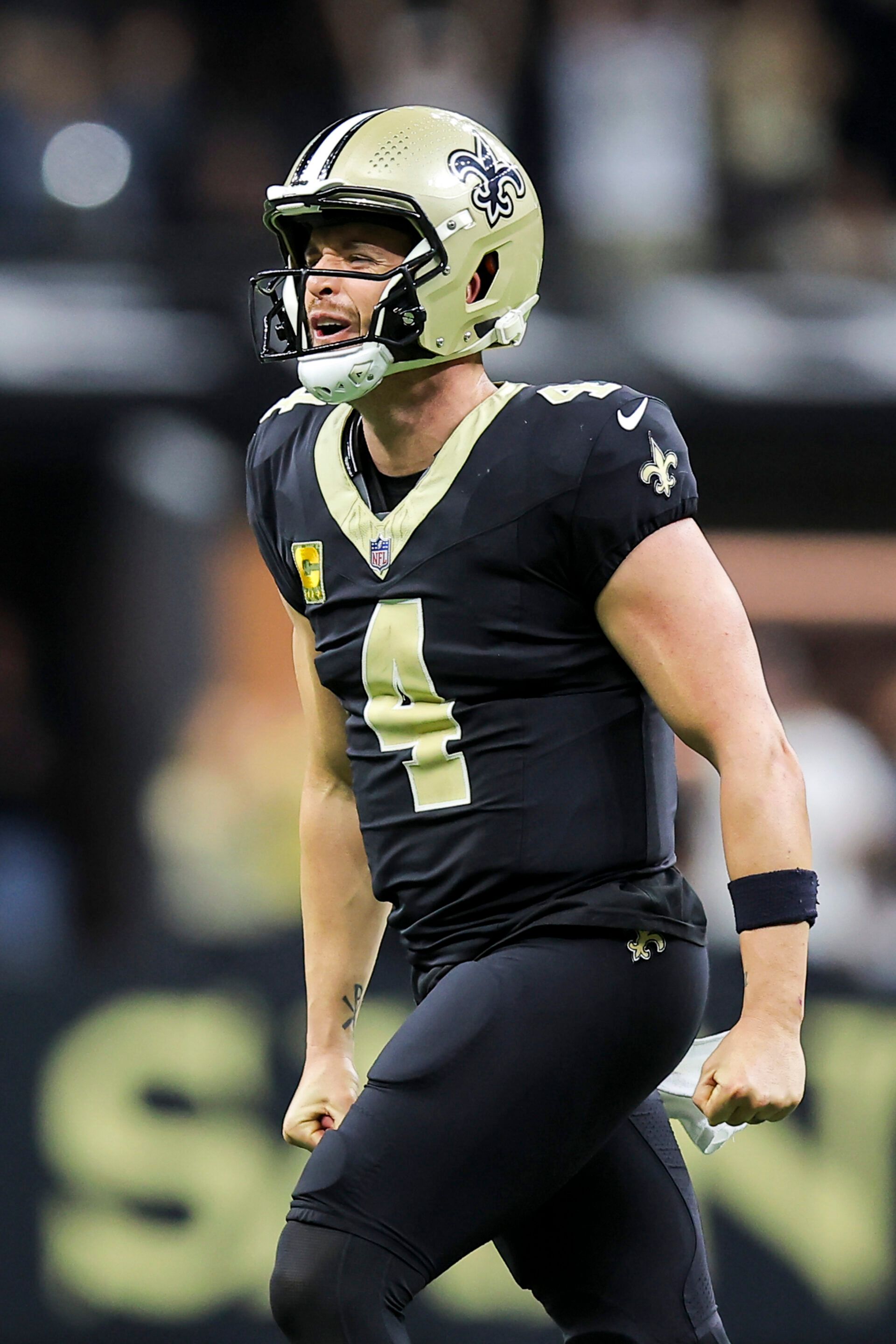 NEW ORLEANS, LOUISIANA - NOVEMBER 10: Derek Carr #4 of the New Orleans Saints reacts after throwing for a touchdown during the second quarter against the Atlanta Falcons at Caesars Superdome on November 10, 2024 in New Orleans, Louisiana. (Photo by Jonathan Bachman/Getty Images)