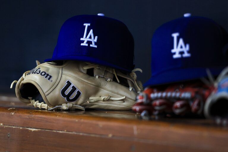 A general view of a Los Angeles Dodgers hat and glove during the second inning in the game against the Cincinnati Reds at Great American Ball Park.