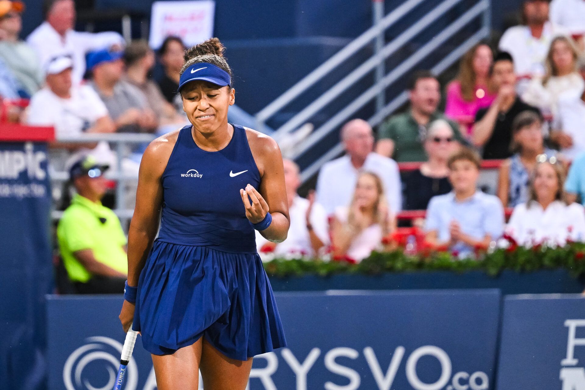 Naomi Osaka (JPN) reacts after a bad play against Victoria Mboko (CAN) during singles final play at IGA Stadium.