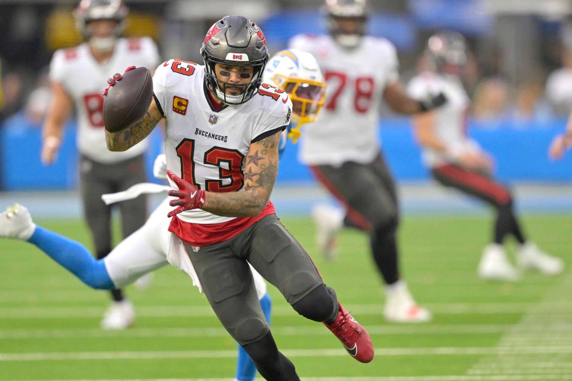 Tampa Bay Buccaneers wide receiver Mike Evans (13) runs for a touchdown on a 35 yard pass play in the second half against the Los Angeles Chargers at SoFi Stadium.
