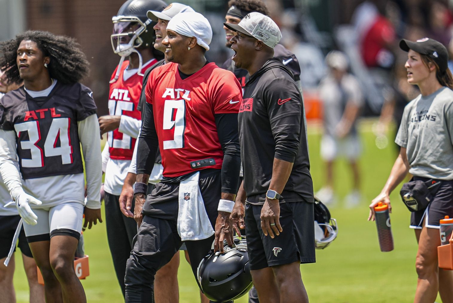 Atlanta Falcons quarterback Michael Penix Jr. (9) and head coach Raheem Morris on the field during Minicamp at Children's Healthcare of Atlanta Training Ground.