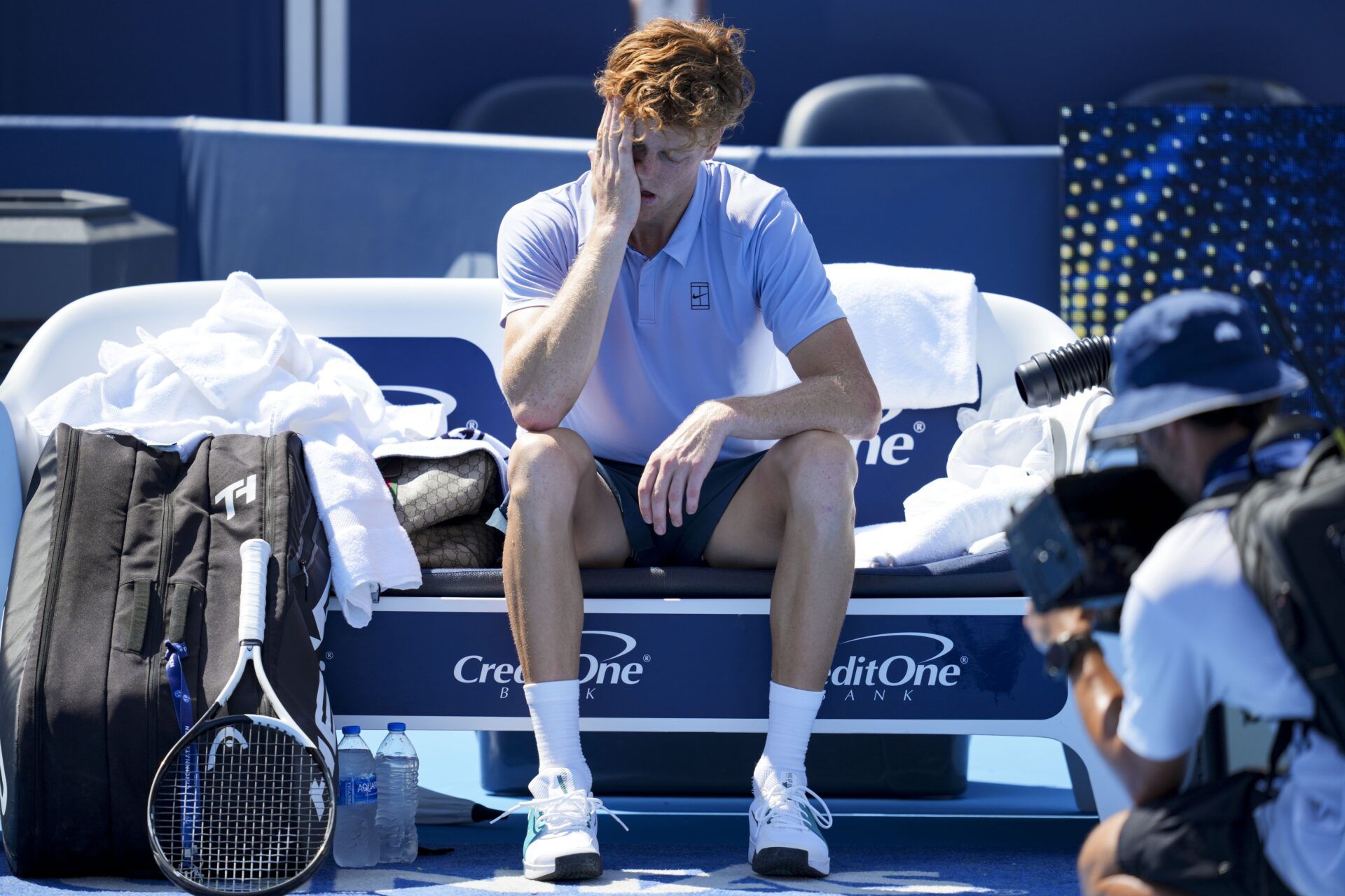 Jannik Sinner (ITA) sits on his bench after retiring from his match against Carlos Alcaraz (ESP) during the Cincinnati Open at the Lindner Family Tennis Center.