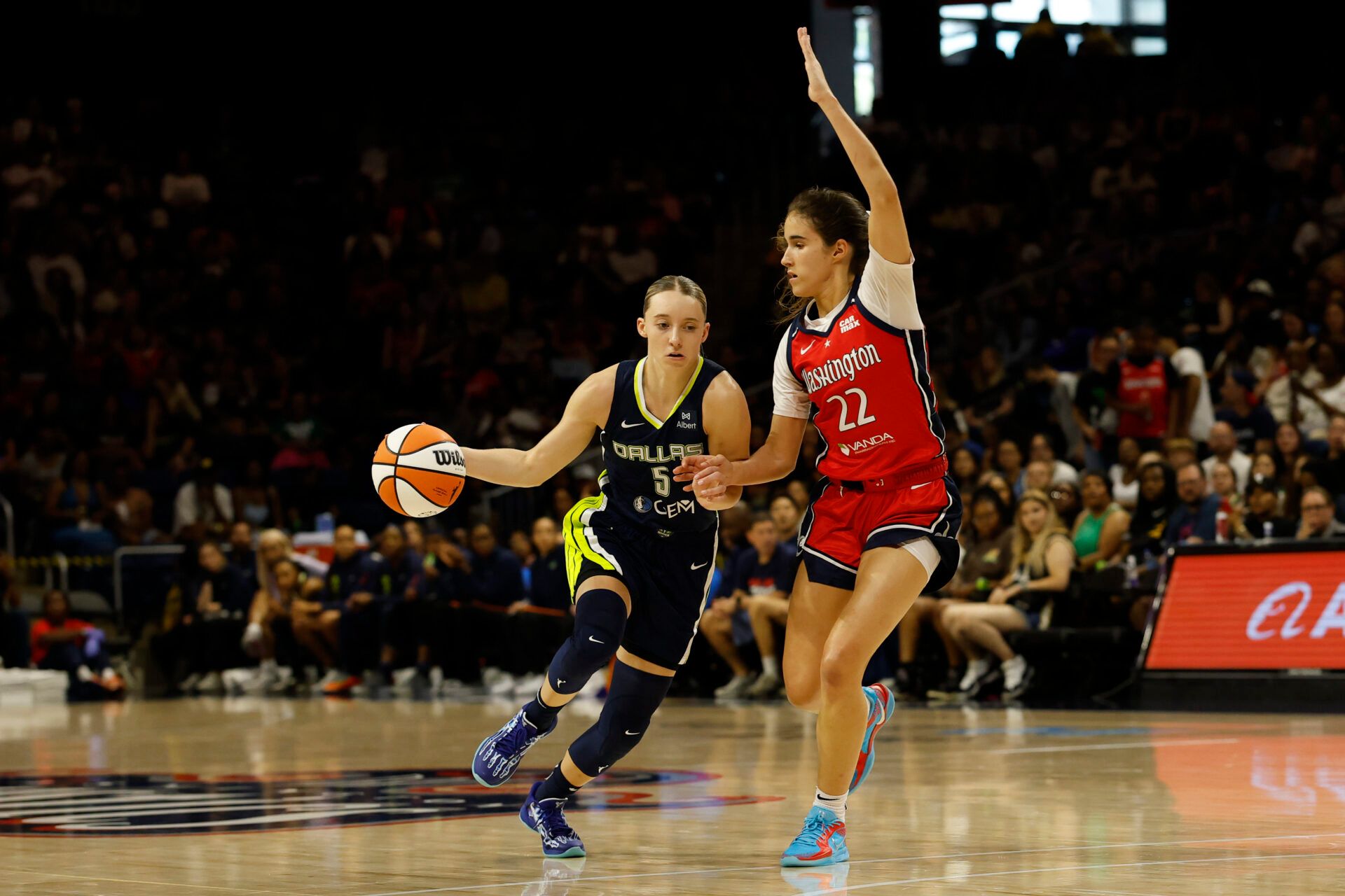 Dallas Wings guard Paige Bueckers (5) dribbles the ball as Washington Mystics guard Sonia Citron (22) defends in the first half at Entertainment & Sports Arena.