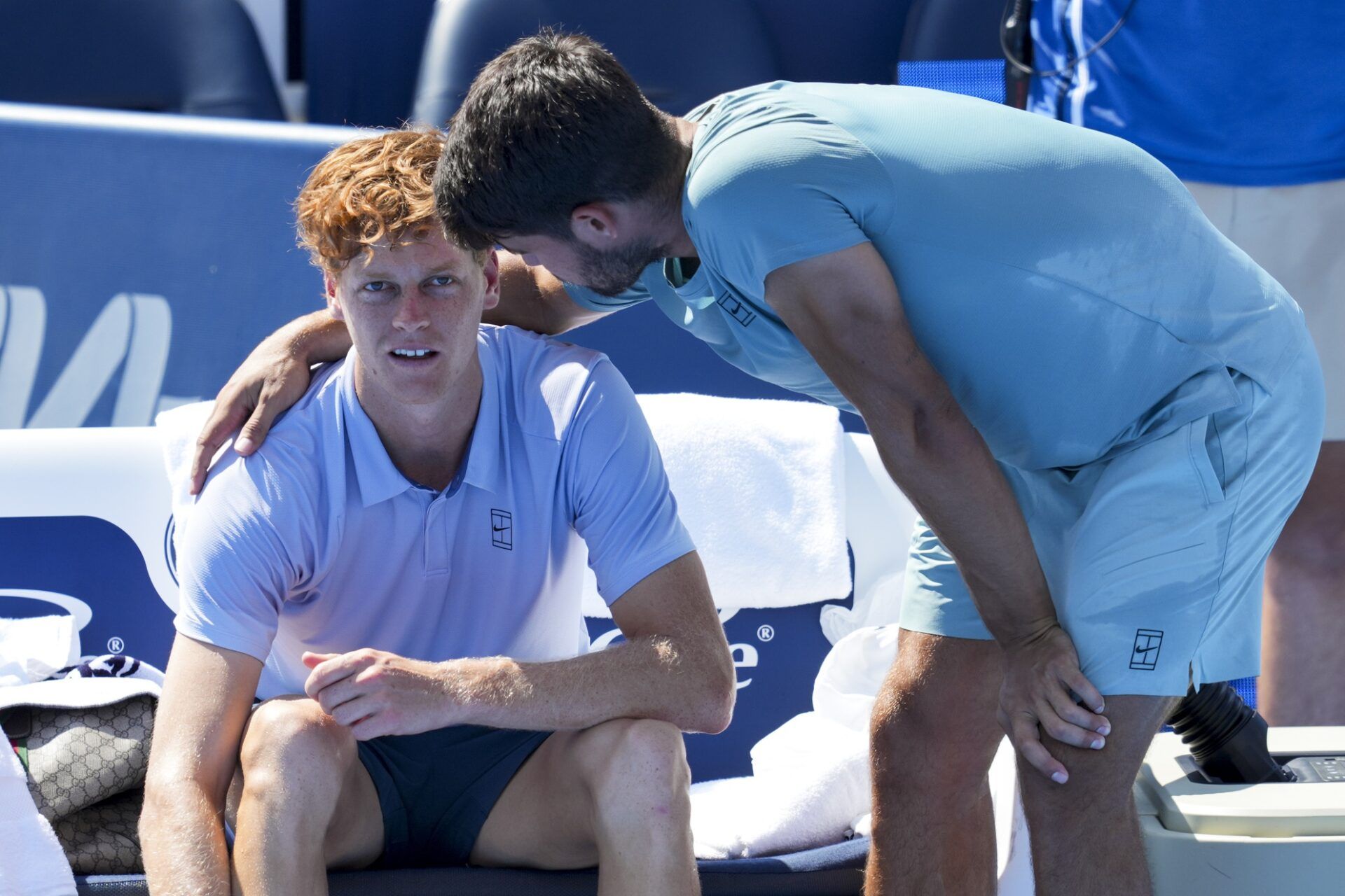 Jannik Sinner (ITA), left, talks with Carlos Alcaraz (ESP) after retiring from their match during the Cincinnati Open at the Lindner Family Tennis Center.