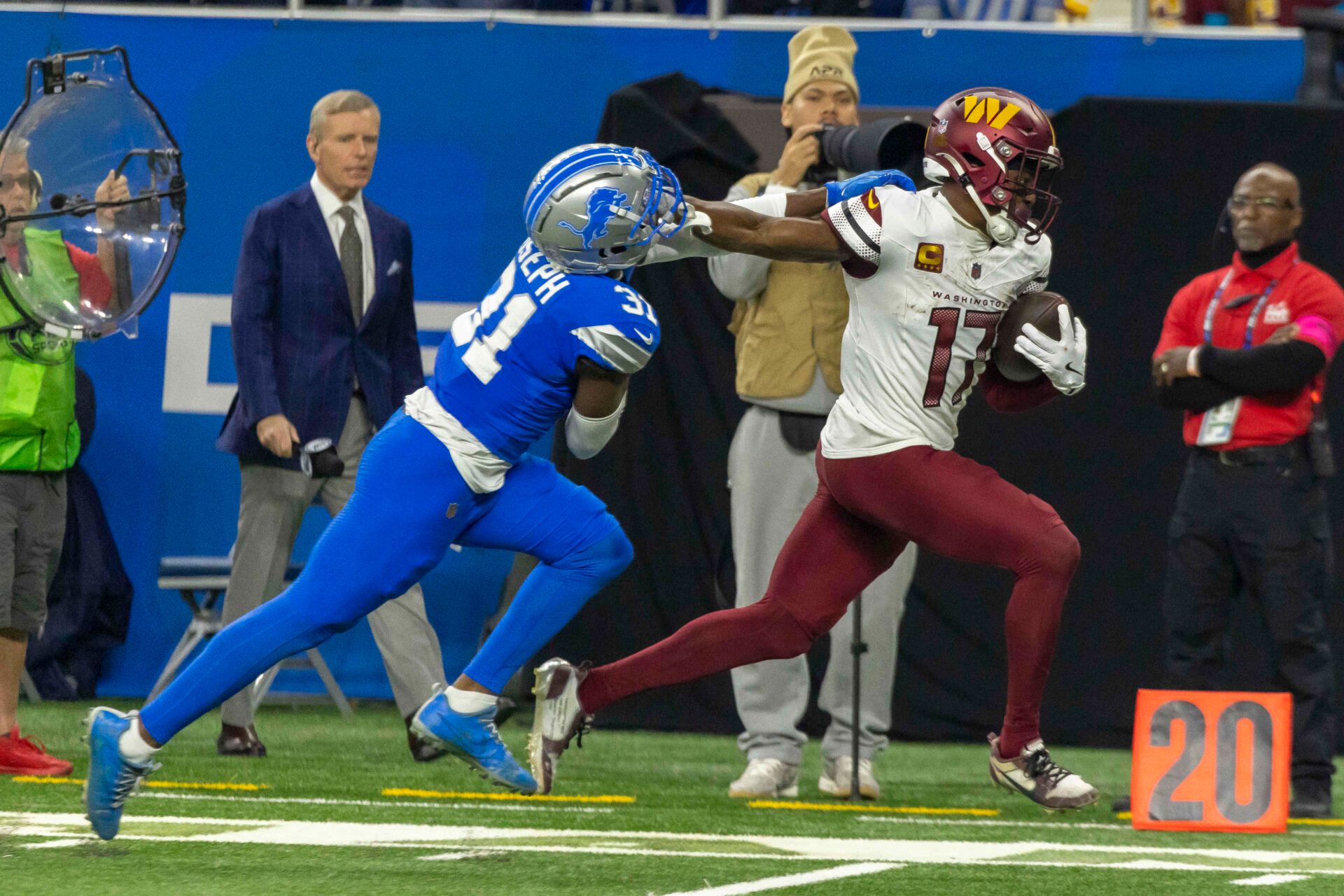 Washington Commanders wide receiver Terry McLaurin (17) runs the ball against Detroit Lions safety Kerby Joseph (31)  during the second quarter at Ford Field.